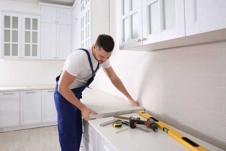 A contractor installing countertops in a kitchen remodel in Walnut Creek, CA.